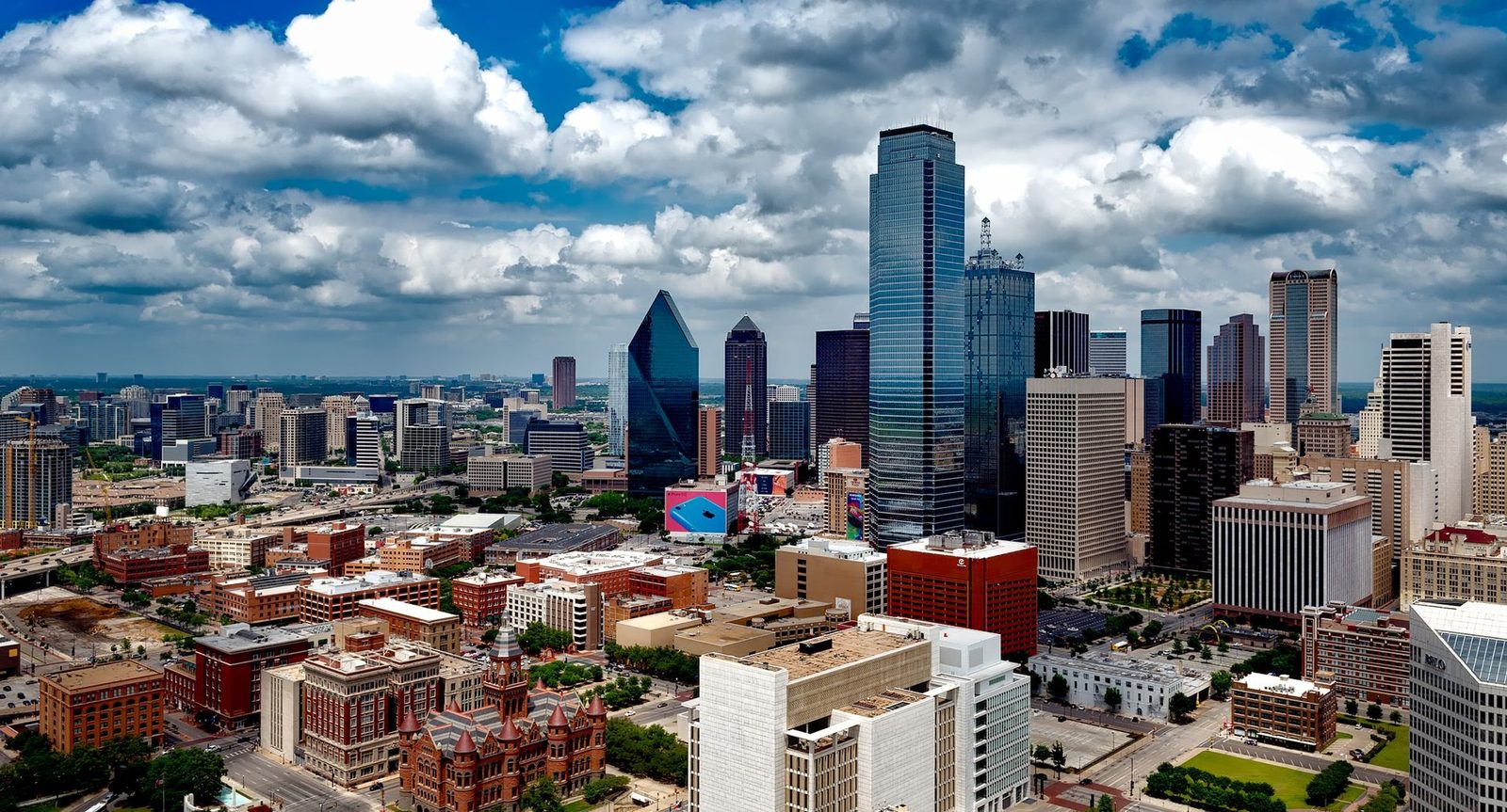 The downtown Dallas, Texas skyline under dramatic clouds